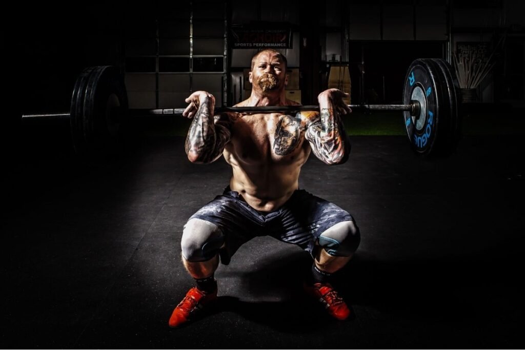 Heavy barbell front squat for basic muscle hypertrophy