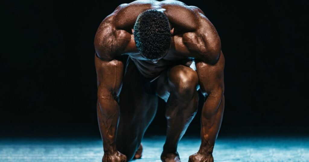 Muscular athlete performing back training for strength and physique development